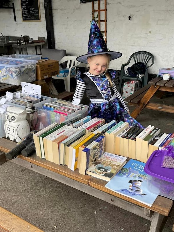 A lovely young witch with second hand book stall