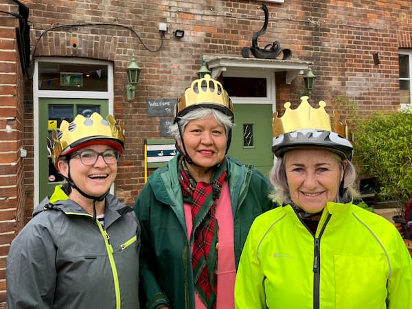 Some of the riders from the Cycle Hub ride with crowns on their helmets.