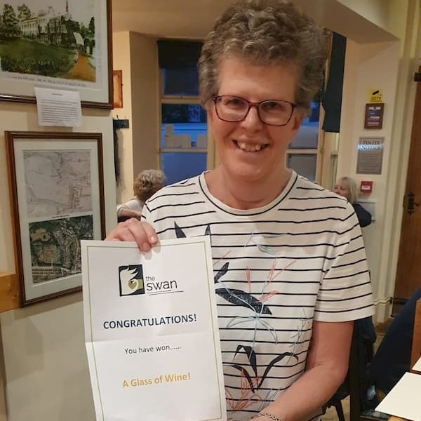 Sue Rigby with her glass of wine certificate