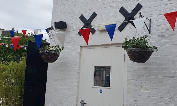 Hanging baskets on The Coach House