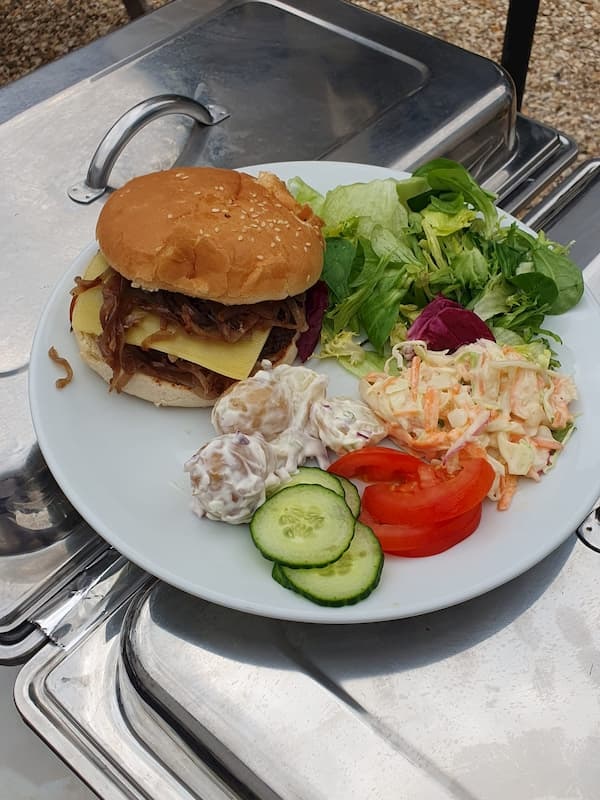 Burger fresh from the BBQ with an excellent salad.