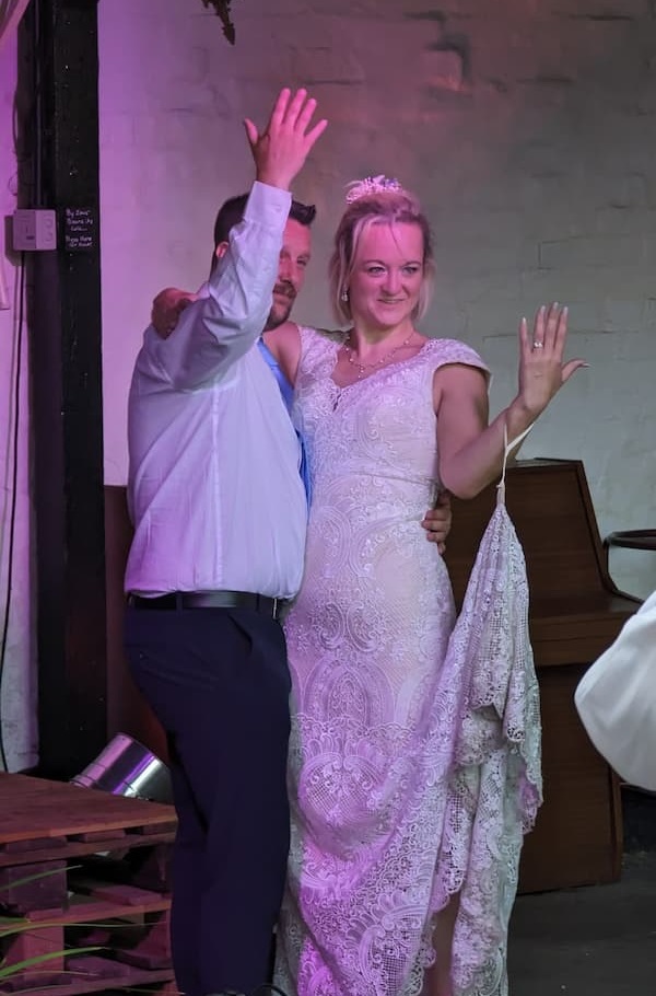 Rachel and David showing off their new rings.