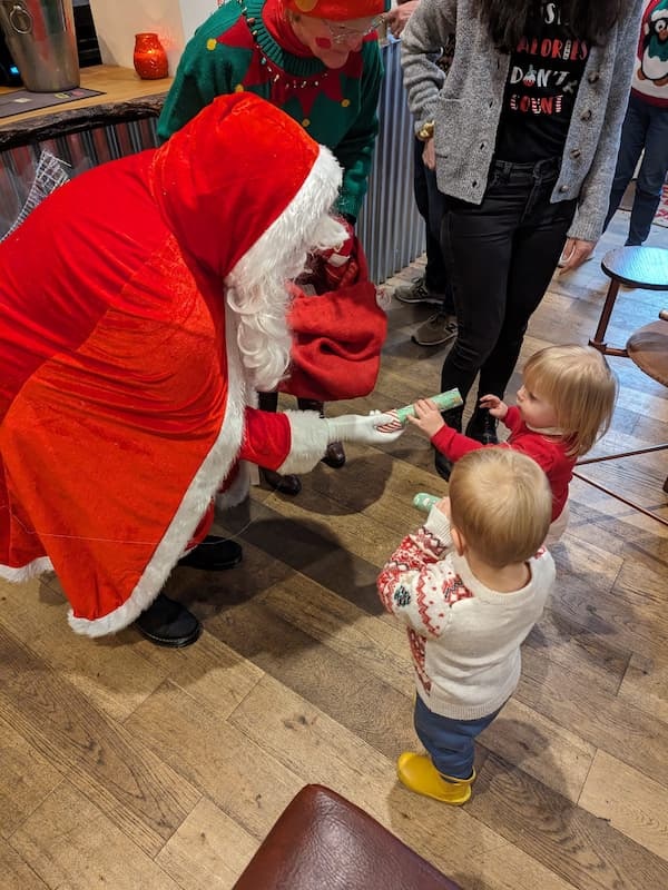 Santa with two young admirers