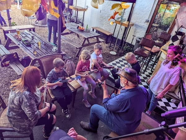 Kids learning to play the ukulele