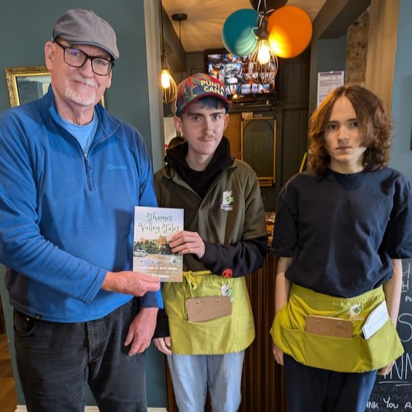 Local author Tim Walker with two of the students