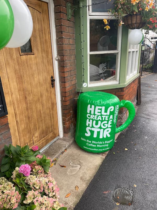 The Macmillan branding outside the pub