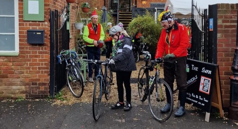 Bike riders leaving via the main gate.