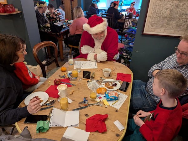 Young lad discussing Christmas with Santa