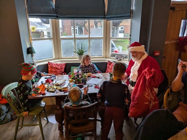 Kids with Santa round a table