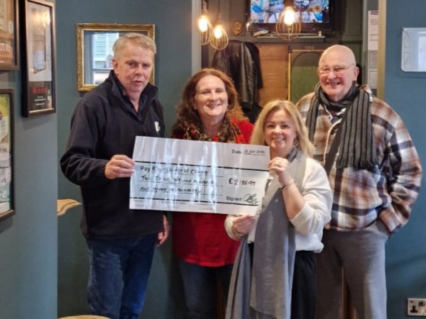 The Friends of The Swan presenting the cheque to the King George 6 team.