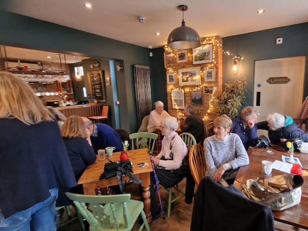 A general shot of the pub with people listening to cheque presentation speech