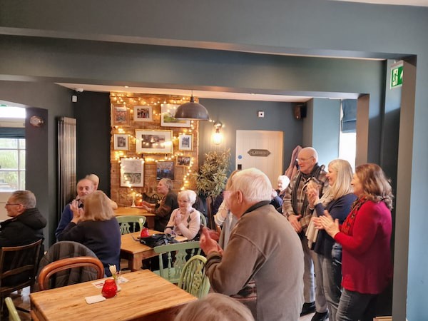 Another part of the pub listening to the cheque presentation speech