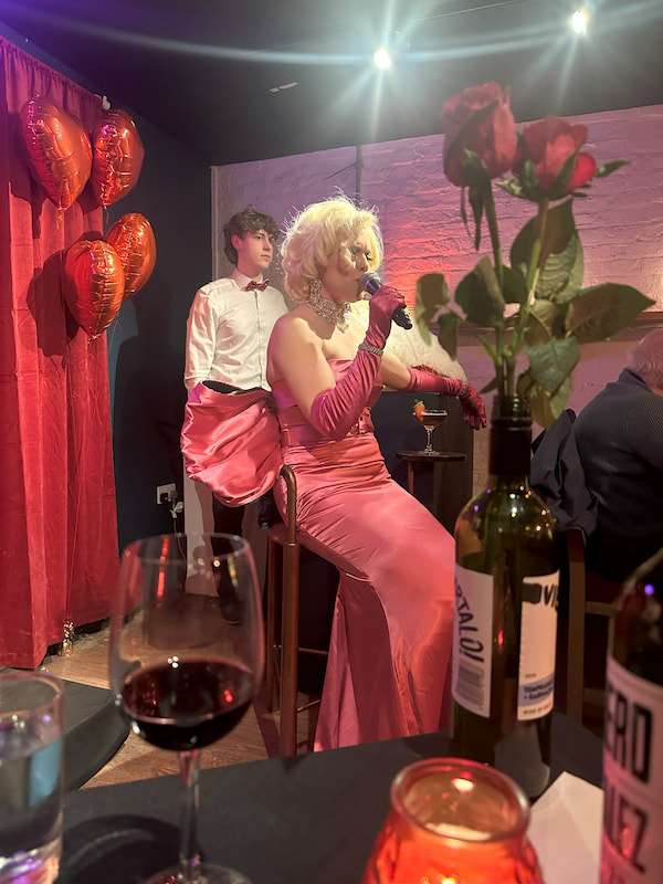 The Coach House was all dressed up in deep red, roses and balloons