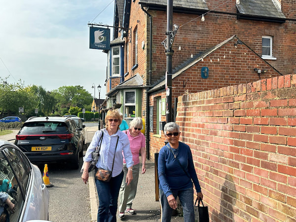 The walkers leaving the pub
