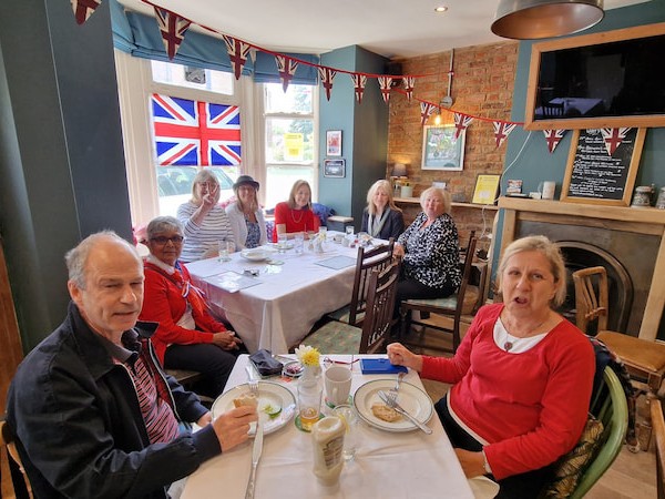 Couple enjoying the 1940s cuisine on offer at VE Day80