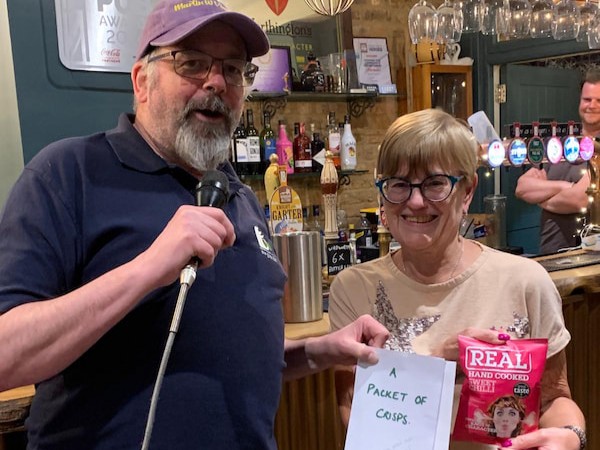 Winner of the 14th May 2025 raffle - Linda from Clewer Clogs won crisps.