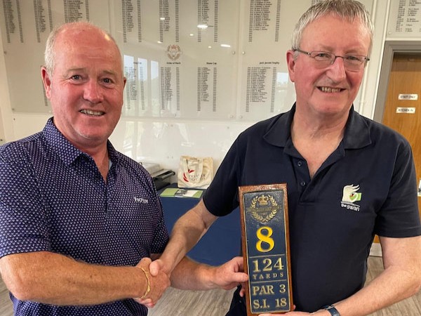 Peter Clifford presenting nearest the pin prize to Eamonn Gannon.