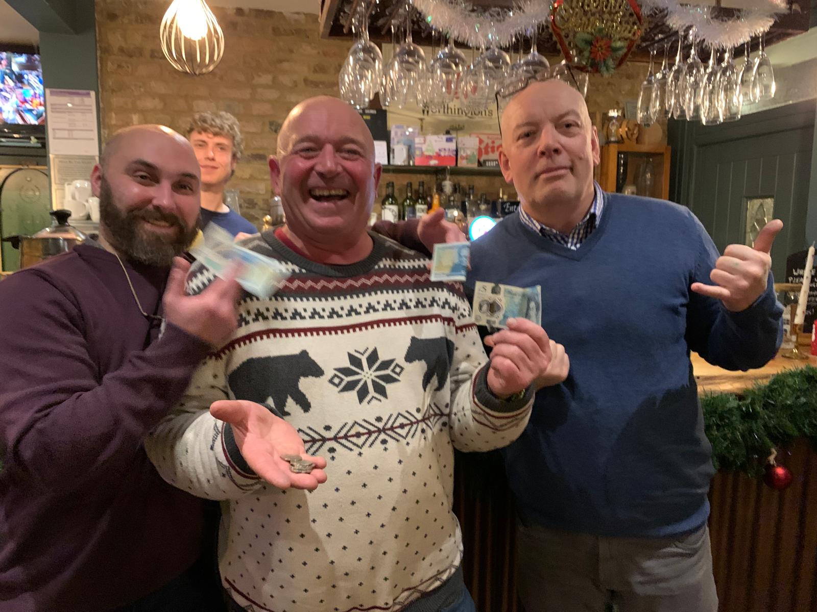 Chris, Craig Courtney, and Michael the barman split the £25 house pot