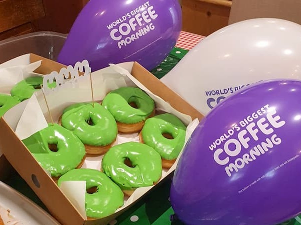 Someone had produced donuts with lime green icing matching the Macmillan colours