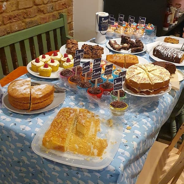 The delicious home baking covering a table.