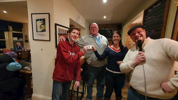 The winners (minus one) with the quiz master and a friend of the swan who was helping out.