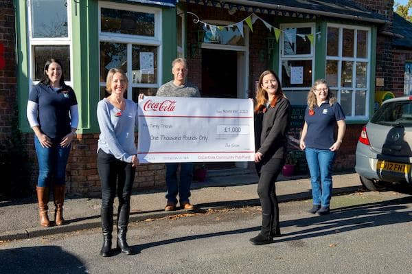 Close up of the cheque outside the pub