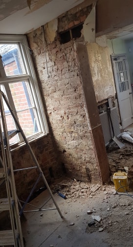 Still removing the old plaster from a lintel