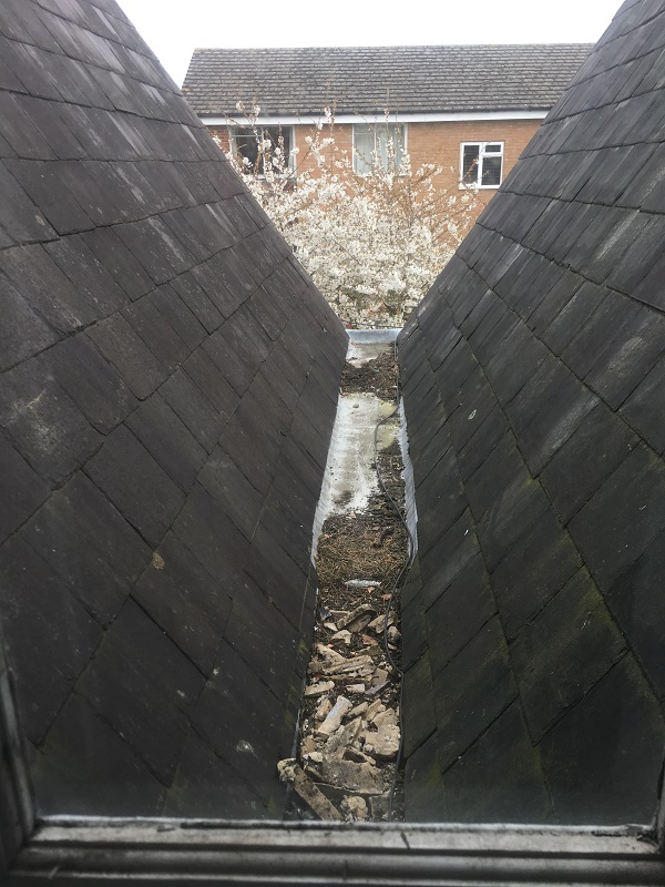 Gully between the roofs has a leak