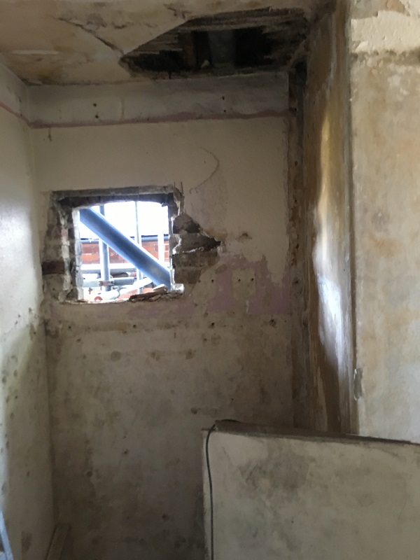 Old cupboard being prepped for water heater