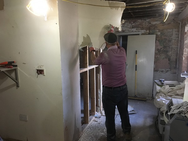 Making the kitchen much bigger by removing the stud partition