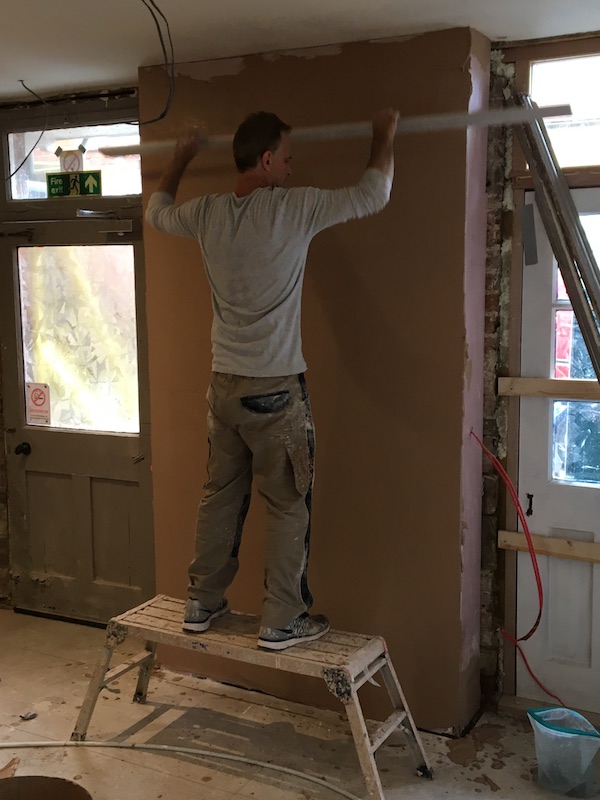 Plastering disused chney that had been boarded day before