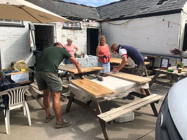 Volunteers helping the school room team