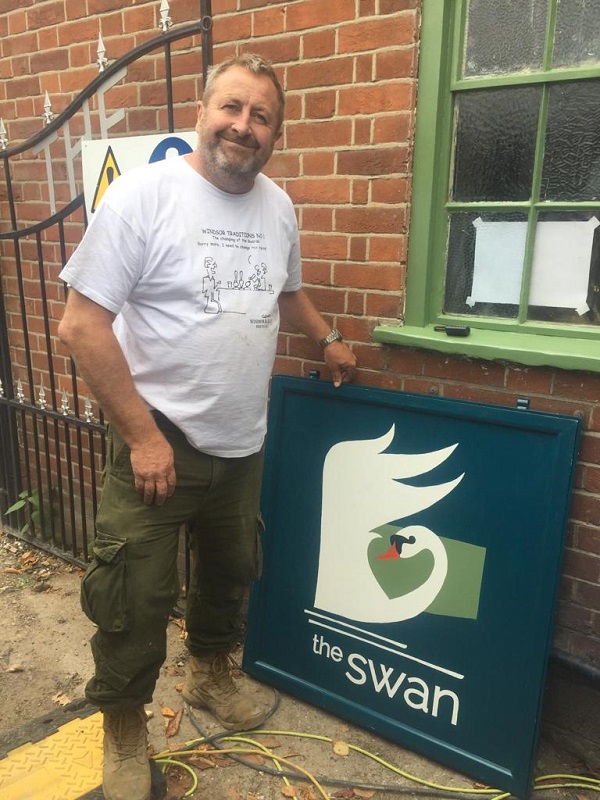 Photographed with the newly returned pub sign