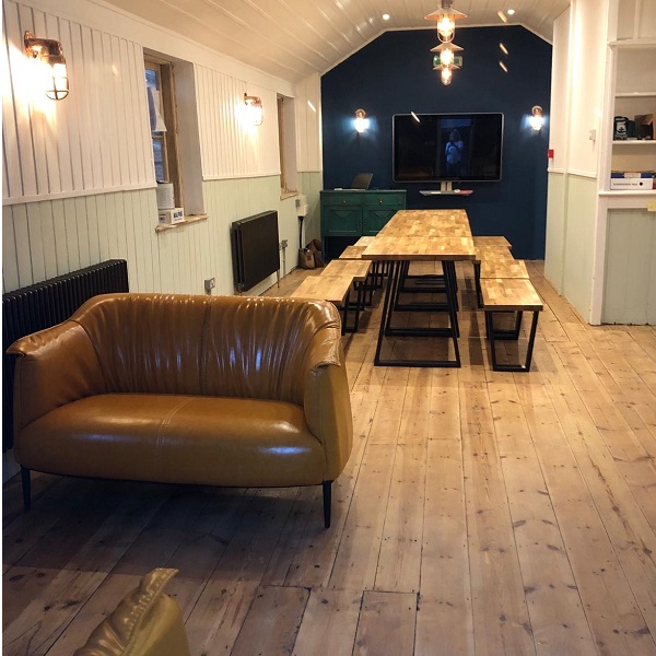 Tables, chairs and sofas looking good on polished floor