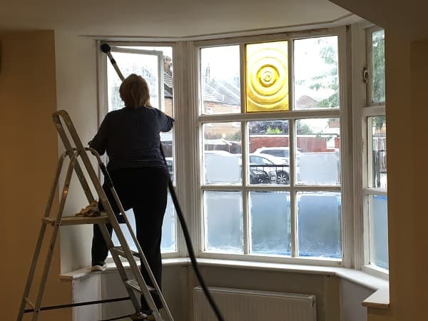 Hoovering to remove the dust