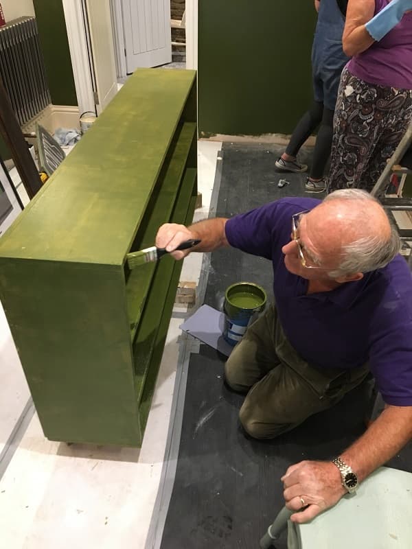 Basil painting the shelving for the glasses