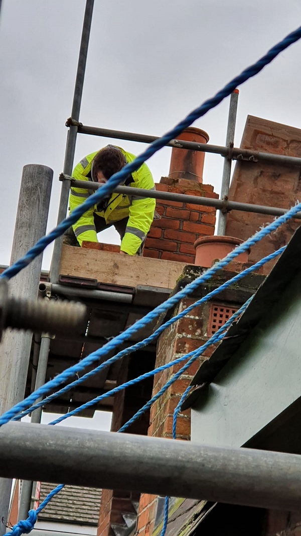 Lads working up on the roof