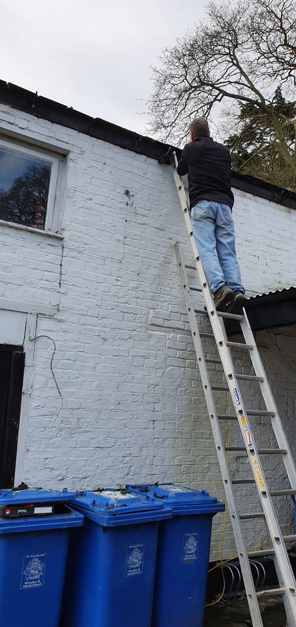 Working at the side of the Coach House roof