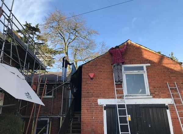 Working at the front of the Coach House roof