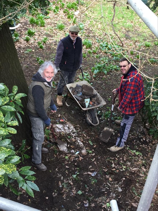 Weekday Warriors clearing more debris behind the kitchen