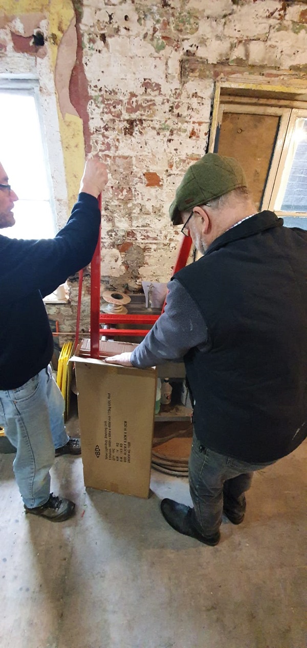 Guys putting the shelving together