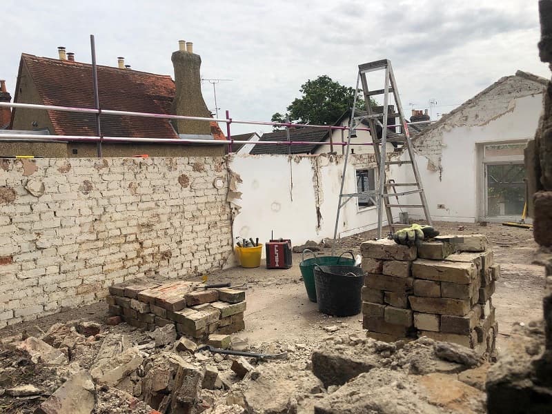 On the first floor of the coach house, roof gone and a lot of bad brickwork removed too