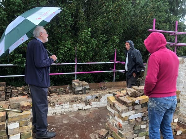 Standing in the rain discussing what is next