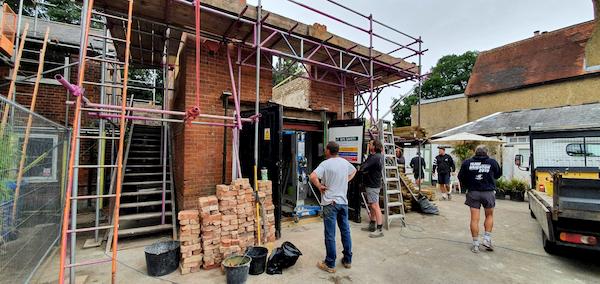 Showing the work going on in front on The Coach House