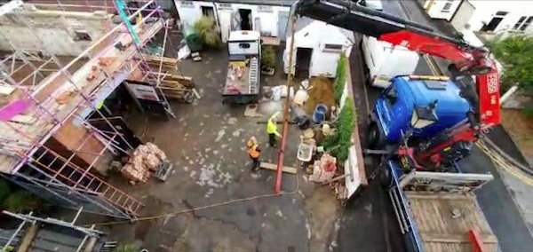 Lorry lifting in a new steel into The Courtyard