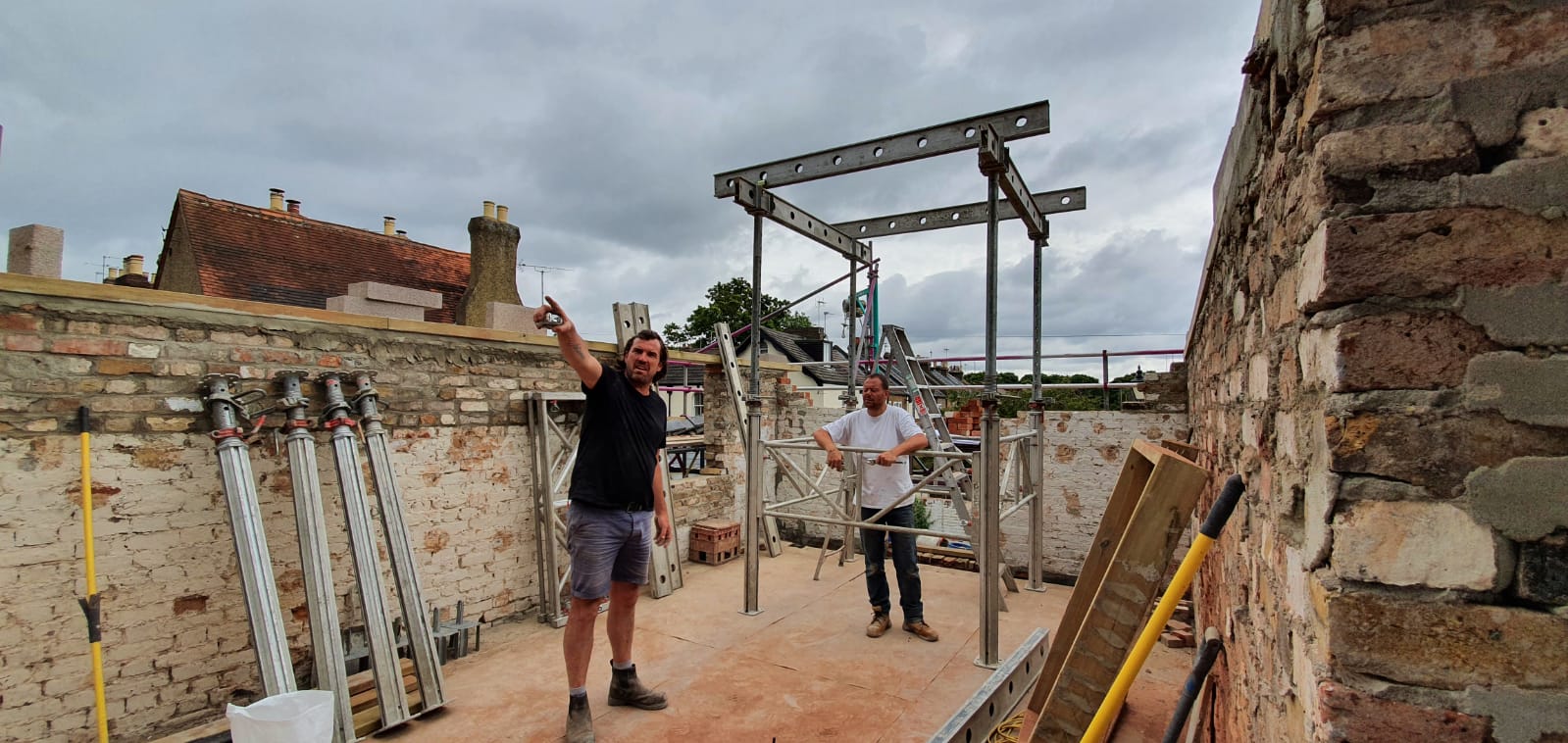 Guys preparing for the new steel lintel to support the roof