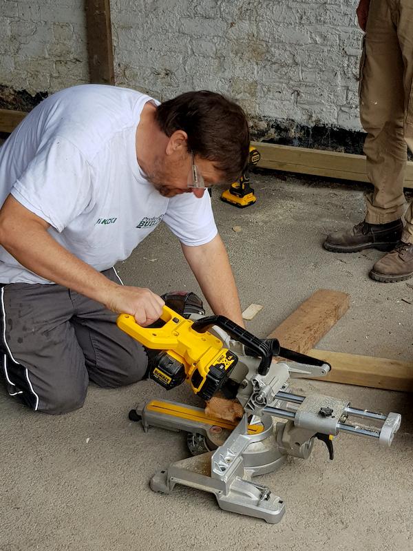 Ian using a circular saw