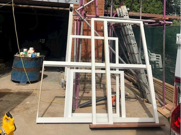 Tarring the roof above the coach house first floor door