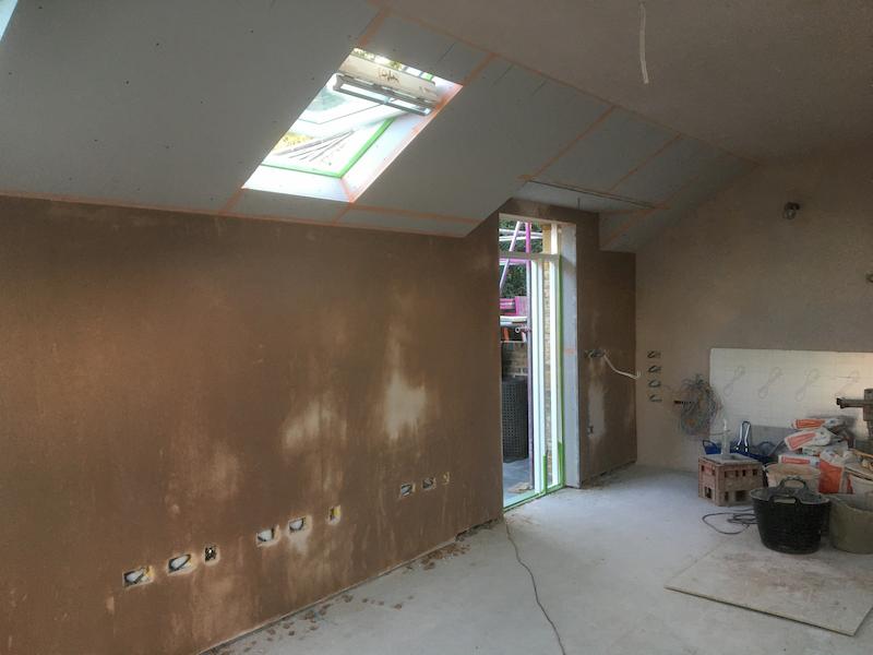 Facing the door, working through the plastering