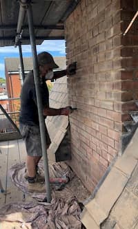 John working on the chimneys (again)